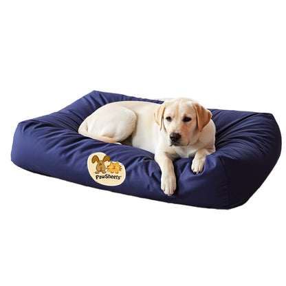 Labrador retriever resting on a bolster style dog bed covered with a dark blue PawSheets dog bed cover
